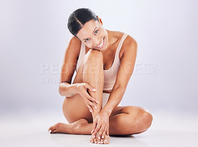 Buy stock photo Legs, body and portrait of woman for beauty and skincare in studio for healthy lifestyle. Happy female on a white background for health, wellness and epilation or shaving self care for soft skin glow