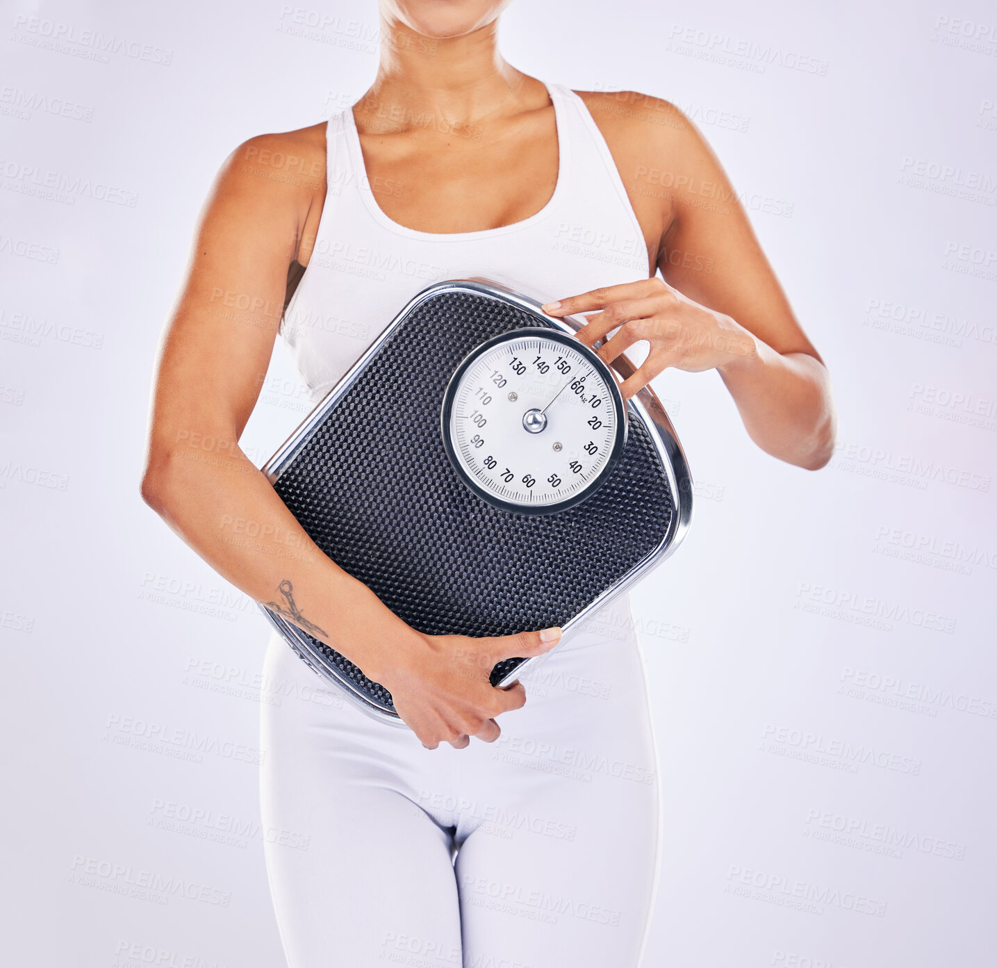 Buy stock photo Hand, scale and woman in studio for wellness, motivation and body positive by background. Girl, model and lose weight for health, target and goals with self care for healthy anatomy by backdrop