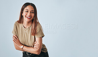 Buy stock photo Portrait, mockup and laughter with an arms crossed woman in studio having fun on a gray background. Comic, comedy and humor with an attractive young female standing indoor feeling playful or carefree
