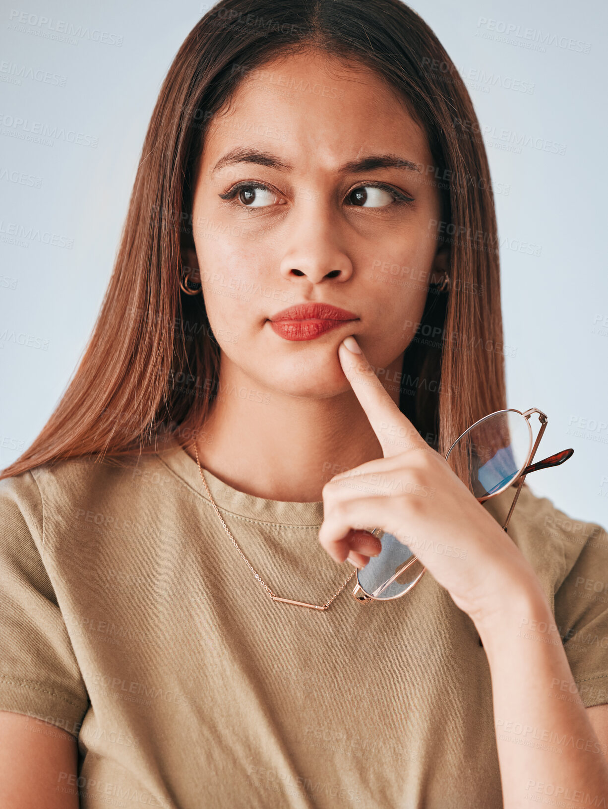 Buy stock photo Thinking, woman and glasses of a young female with decision and choice in studio. Isolated planning, solution and contemplation of a person with focus and creative strategy idea feeling thoughtful