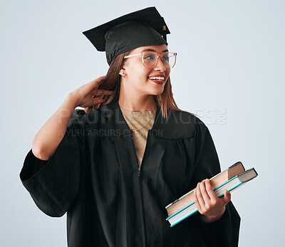 Buy stock photo Graduation cap, books and woman isolated on studio background for happy education, college or scholarship success. Biracial university student or graduate with reading knowledge and learning goals