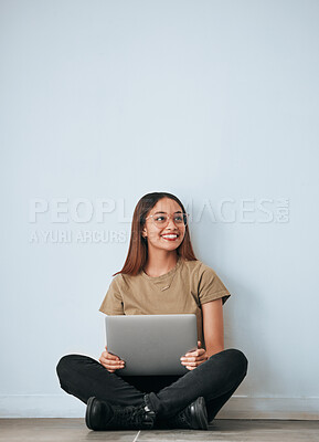 Buy stock photo Laptop, student woman and smile by a wall with computer work for learning with happiness. University, college and house with floor sitting of a happy young person ready for studying with mockup