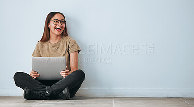 Buy stock photo Thinking, floor and woman laughing with laptop in home by wall background with mockup. Happiness, computer and funny person sitting on ground with pc for online meme, social media and comedy idea.