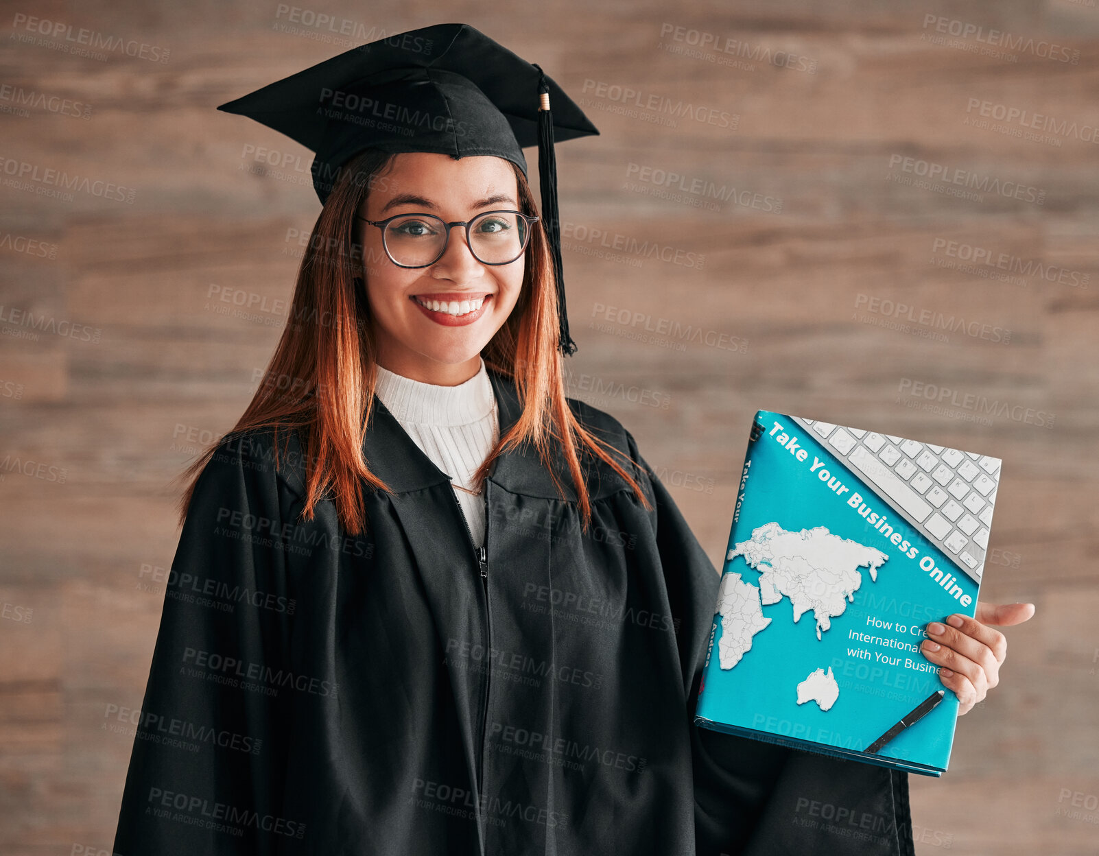 Buy stock photo College graduation, woman and portrait with business textbook of a young student happy. Learning book, happiness and excited female ready for university education with a smile from knowledge