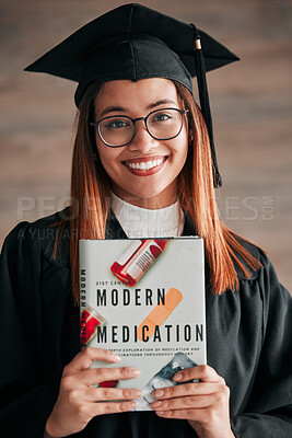 Buy stock photo Doctor graduate, woman portrait and medical textbook of a young student happy from graduation. Learning book, happiness and excited female ready for university education with a smile from knowledge