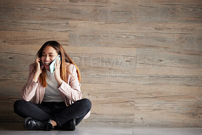 Buy stock photo Woman, phone call and space for communication or connection in studio with advertising mockup. Happy female on wooden background laughing at funny conversation or listening and talking on smartphone