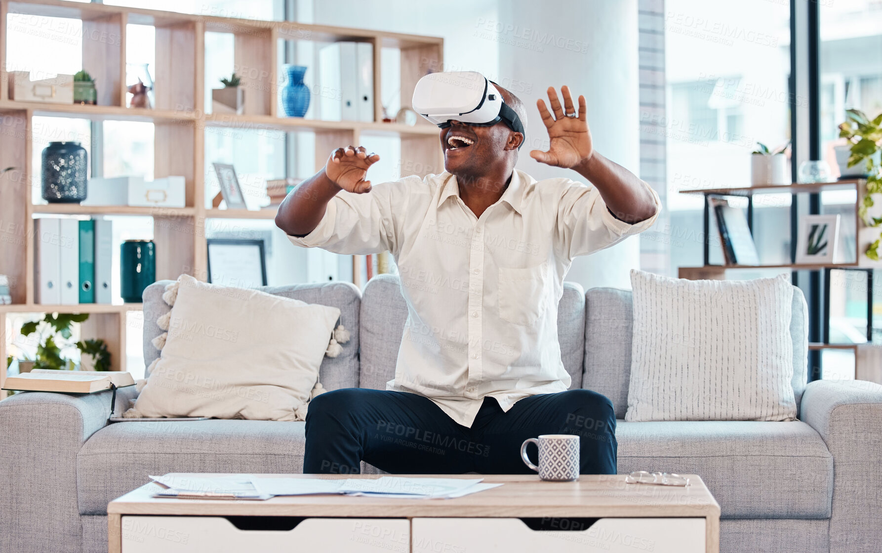 Buy stock photo Happy, man and virtual reality headset in home lounge of cyber experience, metaverse system or gaming connection. Excited black male, VR and games in living room of future innovation of ui technology