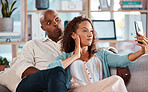 Couple, selfie and funny face on sofa in home living room, bonding or having fun. Interracial, self picture and black man and mature woman relax while taking photo for memory or social media together