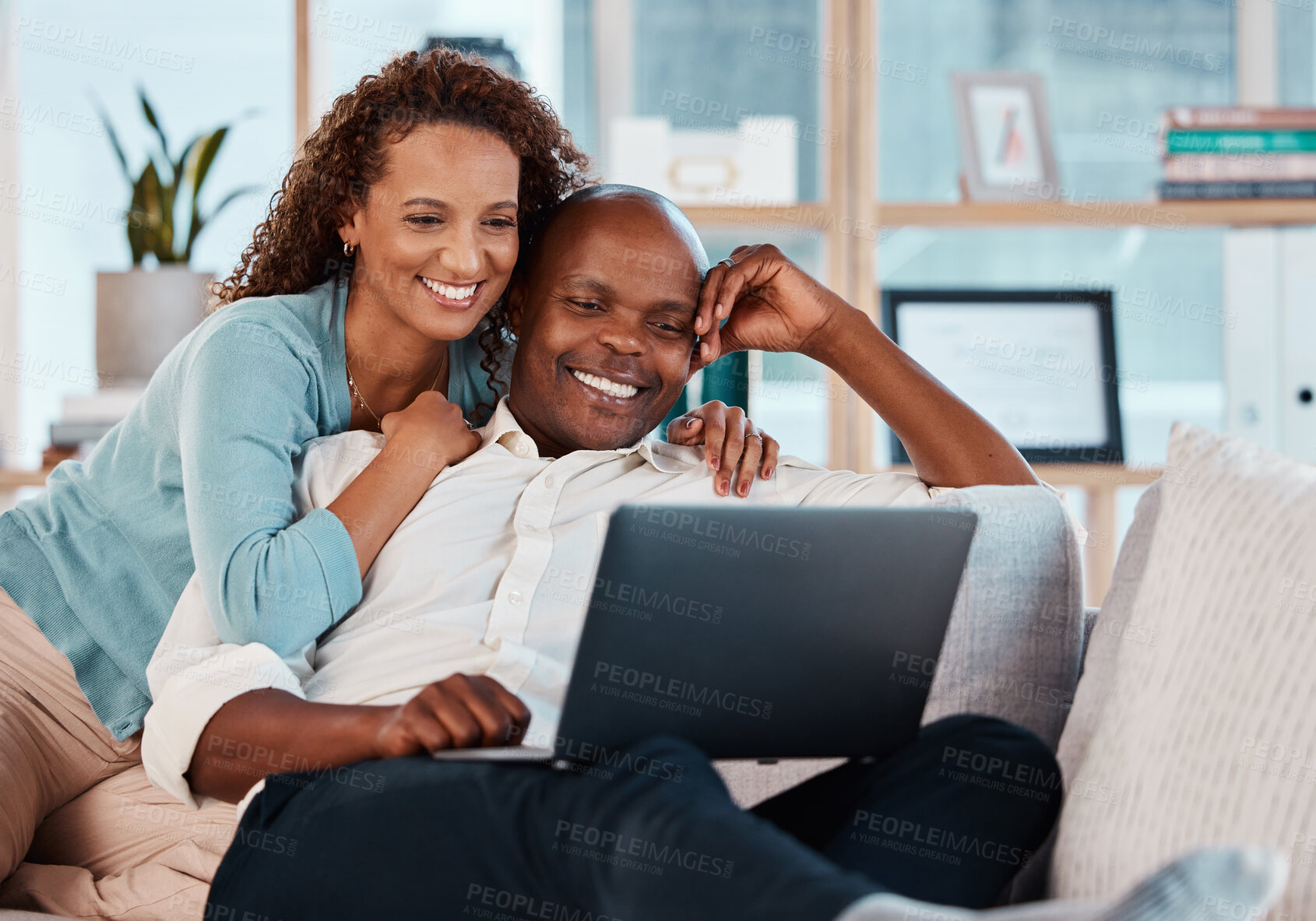 Buy stock photo Laptop, relax and a couple watching a movie on a sofa in the living room of their home together for entertainment. Computer, video or streaming with a man and woman enjoying a series while bonding