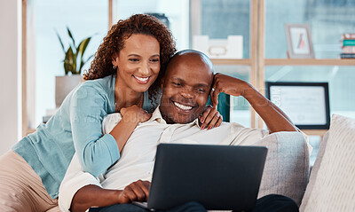 Buy stock photo Laptop, relax and a couple watching a video on a sofa in the living room of their home together for entertainment. Computer, movie or streaming with a man and woman enjoying a series while bonding