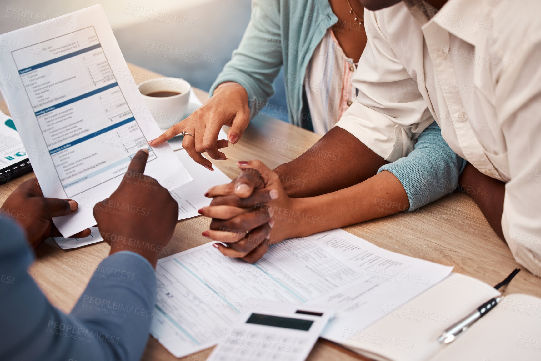 Buy stock photo Couple holding hands, bank and application for loan, finance or mortgage to buy new home with documents. Black man, woman and financial advisor with credit review, paperwork and compliance in office