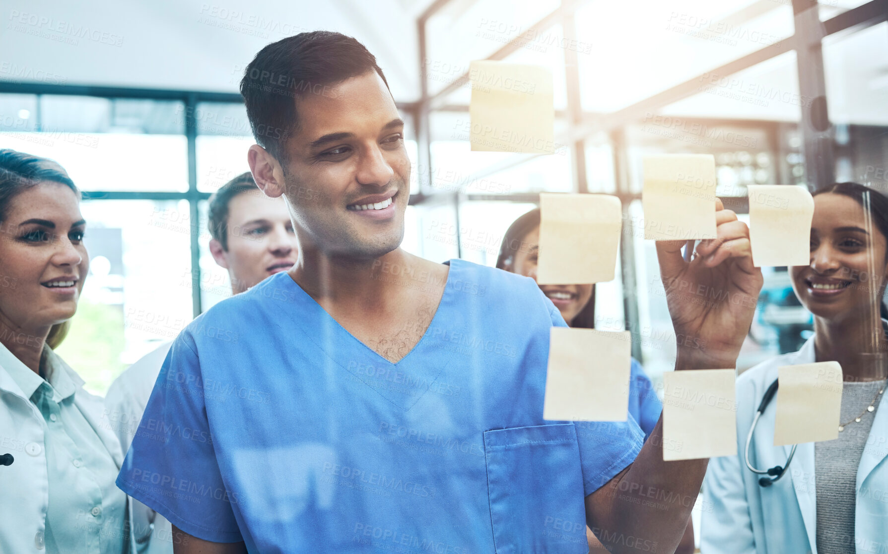 Buy stock photo Doctor, writing and meeting in planning, brainstorming or schedule of team coaching on glass board at hospital. Group diversity of happy medical students in teamwork strategy or sticky note at clinic