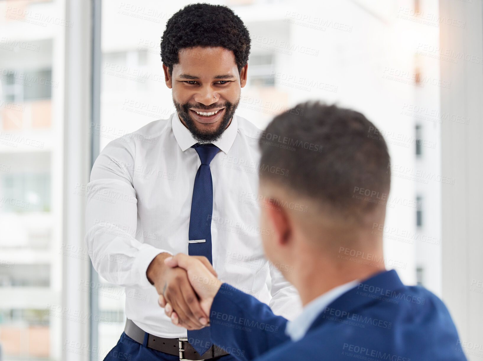 Buy stock photo Businessman, handshake and meeting in partnership for deal, agreement or introduction at the office. Black man employee shaking hands with colleague for b2b, teamwork or collaboration at workplace