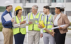 Construction site, team and meeting at a building for planning, creative and collaboration. Architecture, business people and designer group with blueprint, documents and engineering development plan