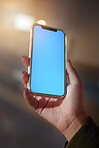 Closeup, hands or smartphone green screen for woman on social media app, night research or internet mockup branding. Blue, mock up or technology for working late person on business product placement 