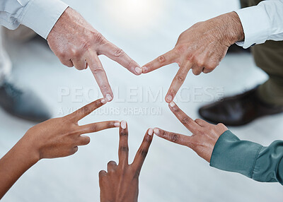 Buy stock photo Teamwork, peace sign and hands of business people for support, motivation and goals in office. Collaboration, solidarity and diversity above of men and women with mission star, trust and cooperation