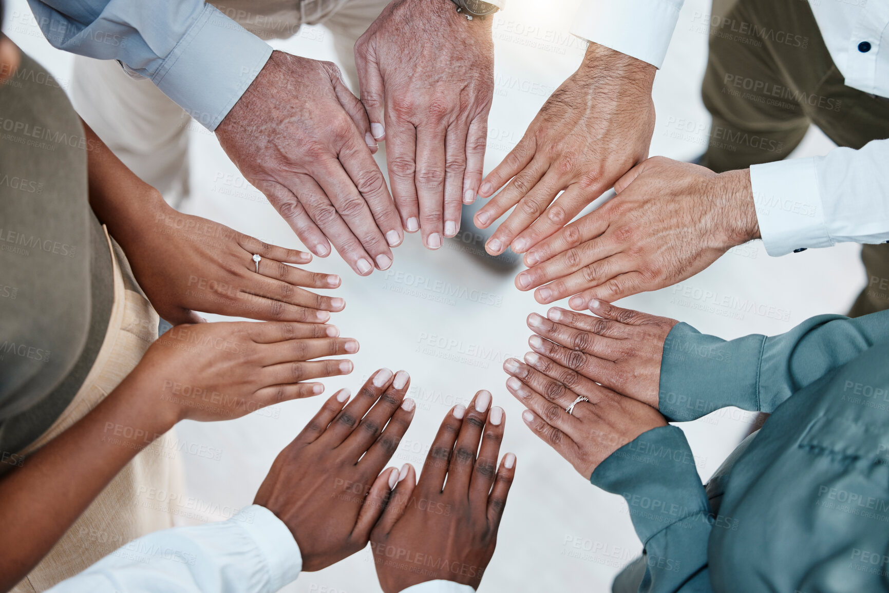 Buy stock photo Teamwork, diversity and hands of business people in circle for motivation, support and community in office. Collaboration, team building and top view of employees palms for goal, trust and solidarity