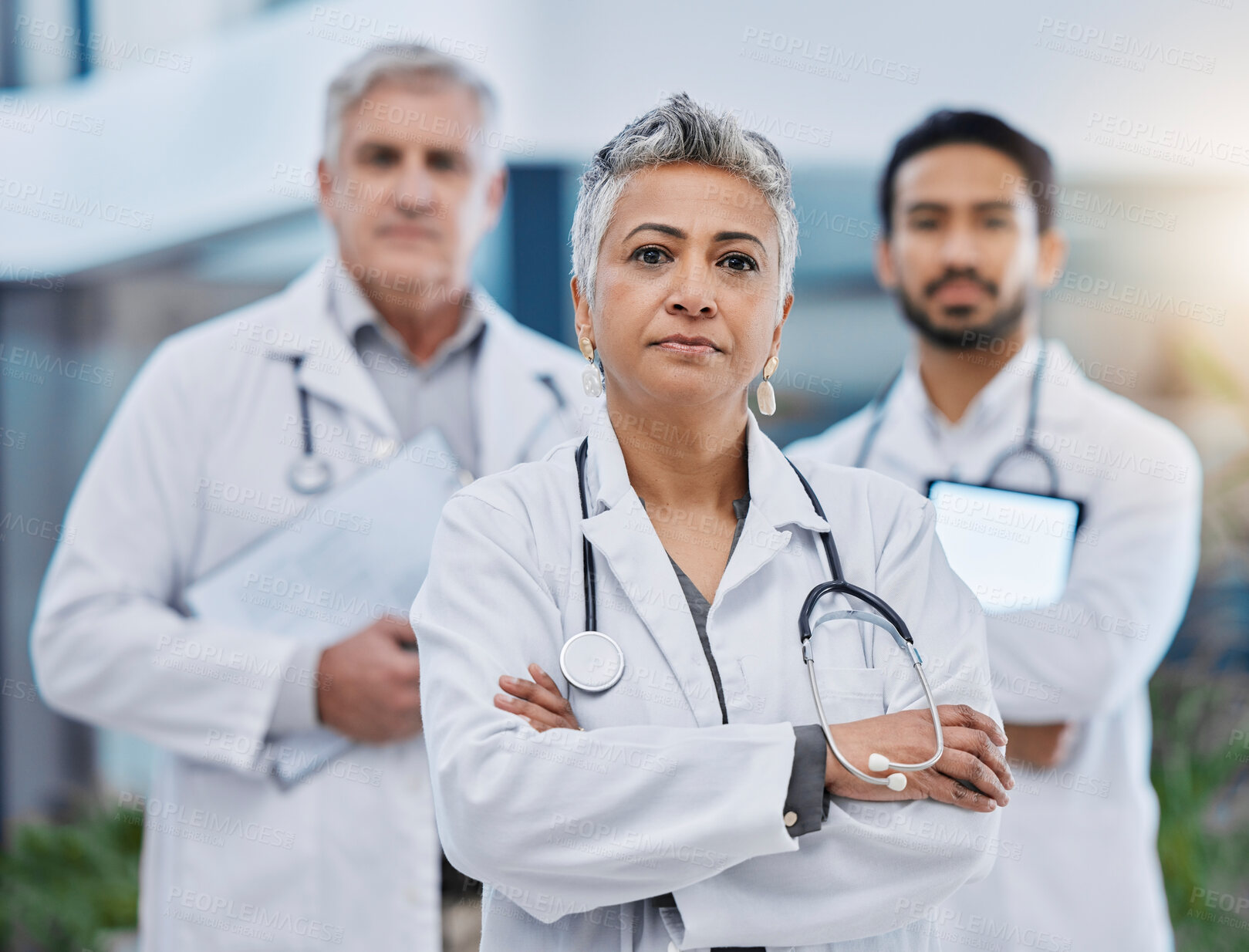 Buy stock photo Senior woman, doctor team portrait and leadership outdoor feeling serious with vision. Healthcare, wellness and professional group with arms crossed and vision ready for medical and clinic teamwork
