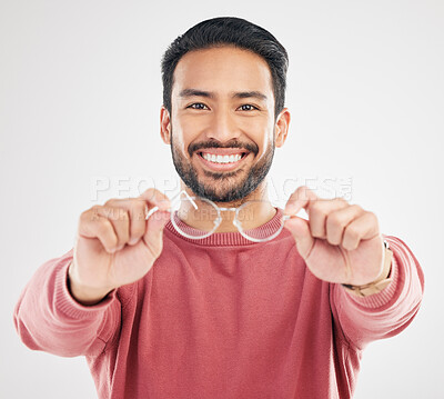 Buy stock photo Glasses, man smile and portrait in a studio happy from vision and showing eyewear choice. Isolated, white background and happiness of an Asian male model with lens prescription and frame decision