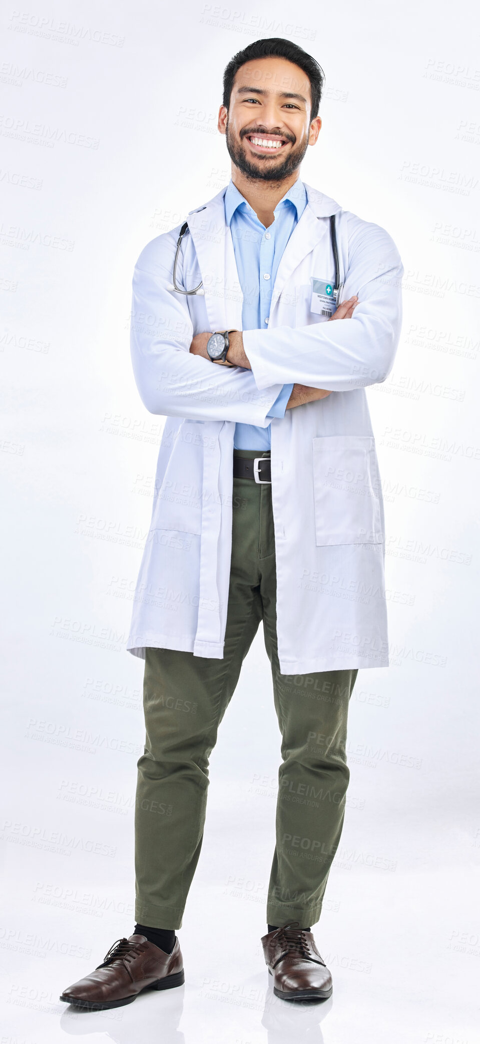 Buy stock photo Happy man, portrait and doctor in a studio with confidence ready for work. Isolated, white background and arms crossed of a proud surgeon with happiness from healthcare, wellness and hospital job