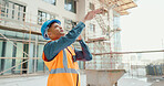 Construction worker, radio communication and building contractor with team leadership for skyscraper architecture project. Industrial engineer, professional builder and engineering construction site