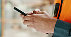 Social media, internet and hands of an architect with a phone for communication, construction website and building app. Construction worker working on a mobile, typing on web and doing search on site