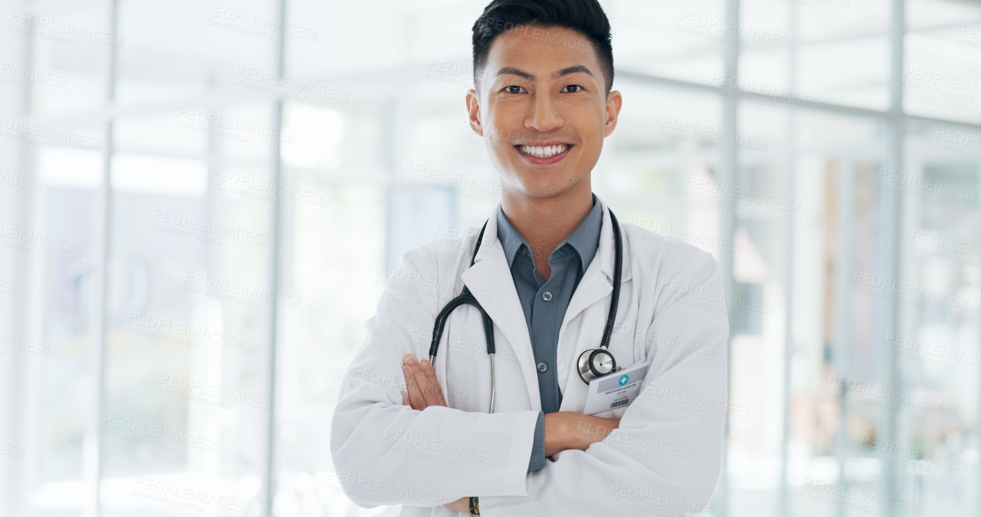 Buy stock photo Medical, asian man and portrait of doctor in hospital for healthcare career in medicine or surgery in a clinic. Confident, happy and young surgeon, expert or medicare professional ready for surgery