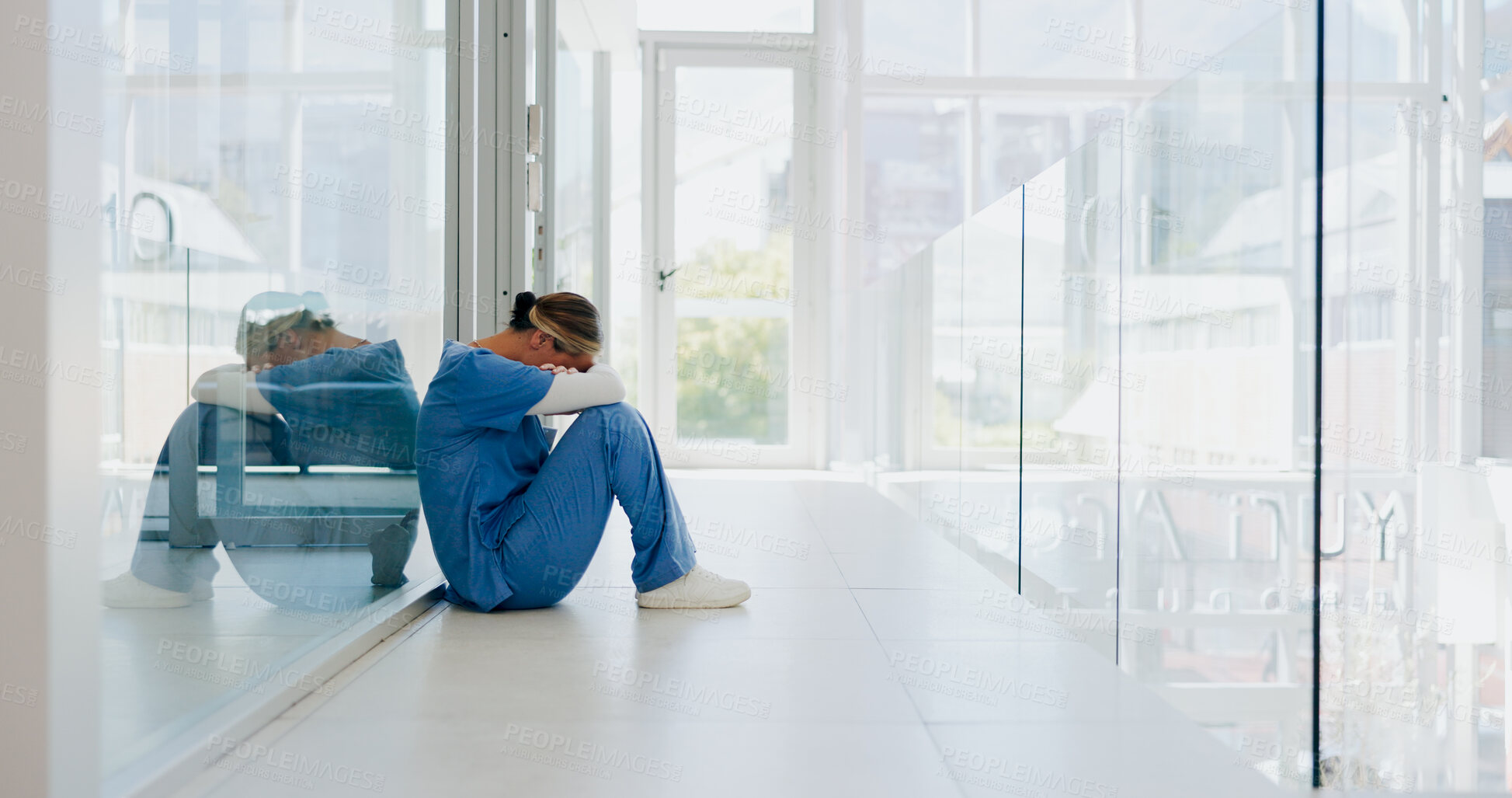 Buy stock photo Doctor, floor and depression with stress, sad or anxiety in mental health for mistake, thinking or burnout. Nurse, crying and loss for death, sitting and tired with fail, healthcare or clinic hallway