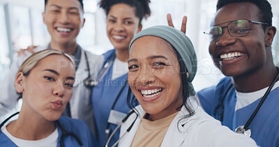 Buy stock photo Doctors, nurses and teamwork selfie with smile in hospital with diversity, healthcare and social media. Photography, men and women together, happy staff and medical professional friends at clinic.