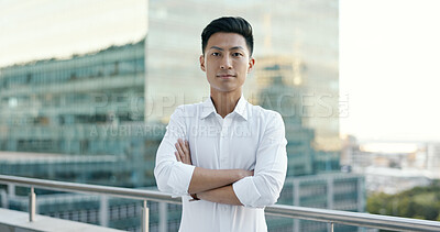 Buy stock photo Portrait, arms crossed and Asian man on office building balcony with confidence, pride and business entrepreneur. City, terrace and proud businessman with urban job at consulting startup on cityscape