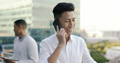 Buy stock photo Asian man, phone call on city building balcony for networking and connection in business negotiation. Office, terrace and businessman with cellphone discussion for deal, consulting and communication.