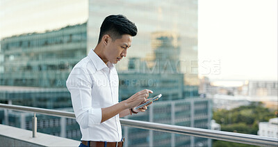 Buy stock photo Asian man, typing with phone on office building balcony for networking and search in business online. City, terrace and businessman with cellphone, social media scroll for consulting or communication