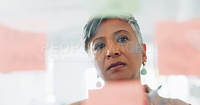 Buy stock photo Business woman, face and thinking in schedule planning, brainstorming or idea for strategy on glass board at office. Senior female person or CEO in project plan, agenda or tasks on board at workplace