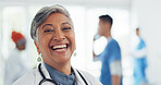 Face, doctor and woman laughing in hospital ready for tasks, goals or targets. Leadership, senior or portrait of comic healthcare worker or female medical physician happy with career or job at clinic