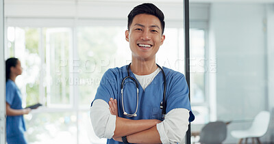 Buy stock photo Portrait, Asian man and nurse with arms crossed, healthcare and smile with career in a hospital. Face, Japanese person and medical professional with happiness, surgeon and physician with uniform