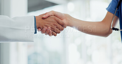 Buy stock photo Doctor, handshake and meeting in hospital, thank you or partnership in healthcare or teamwork. Closeup of people, nurse or medical professional shaking hands in deal, agreement or clinic introduction