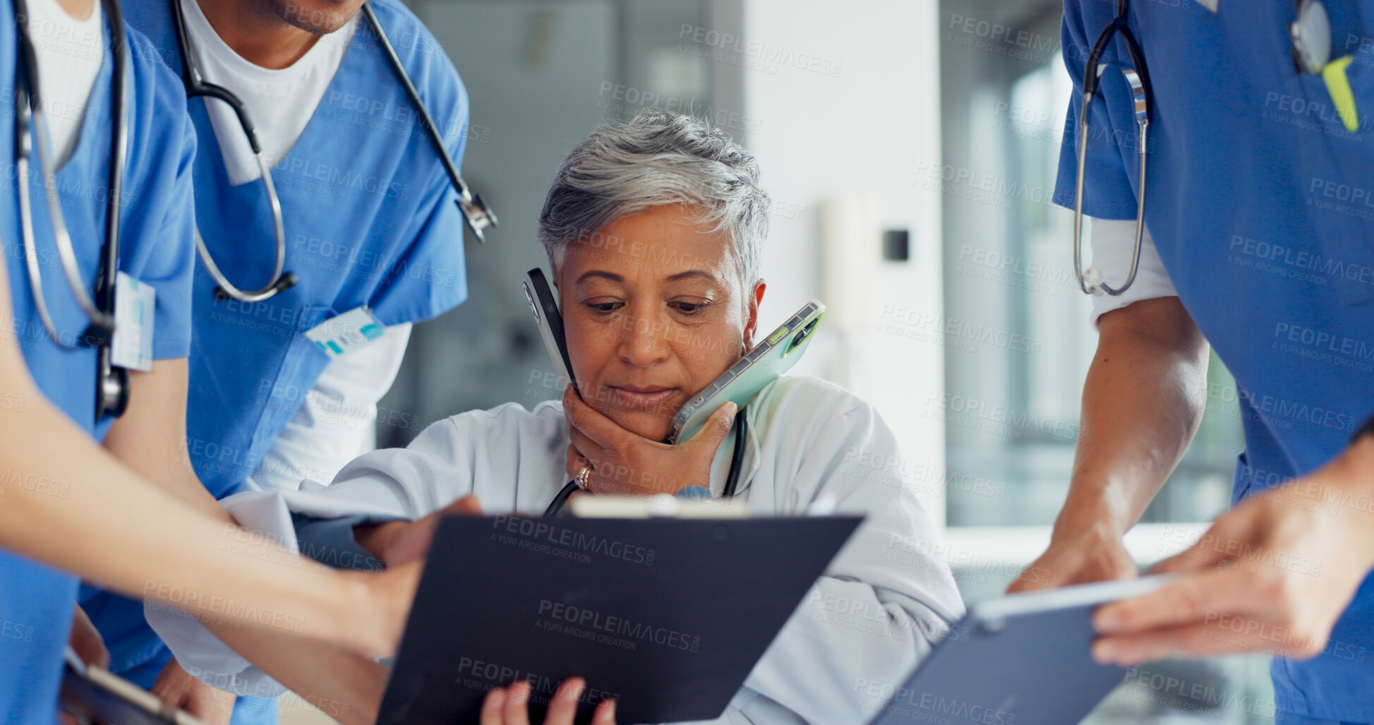 Buy stock photo Busy doctor, team and stress in hospital, multitask and overworked in clinic. Burnout, chaos and mature medical professional overwhelmed in healthcare on phone call, anxiety and workflow pressure.