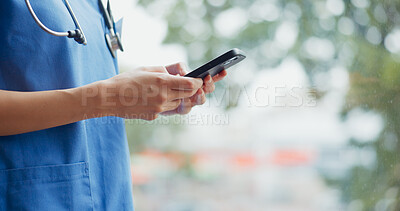 Buy stock photo Woman, hands and phone of doctor typing for online consultation, advice or outdoor networking at hospital. Closeup of female person, nurse or medical worker on mobile smartphone for communication