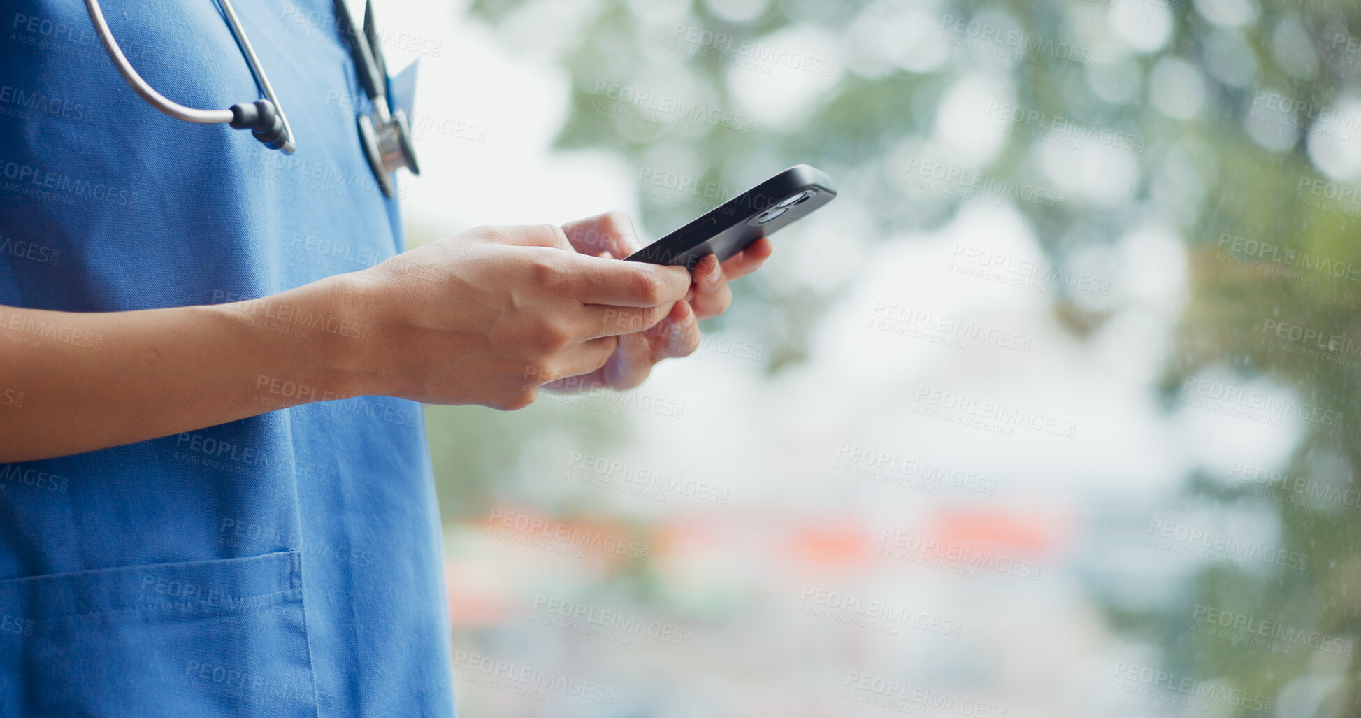 Buy stock photo Woman, hands and phone of doctor typing for online consultation, advice or outdoor networking at hospital. Closeup of female person, nurse or medical worker on mobile smartphone for communication