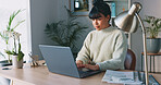 Business woman thinking, typing on laptop and researching while writing an email or article and sitting in a modern office. Serious, creative entrepreneur using technology for online computer communication