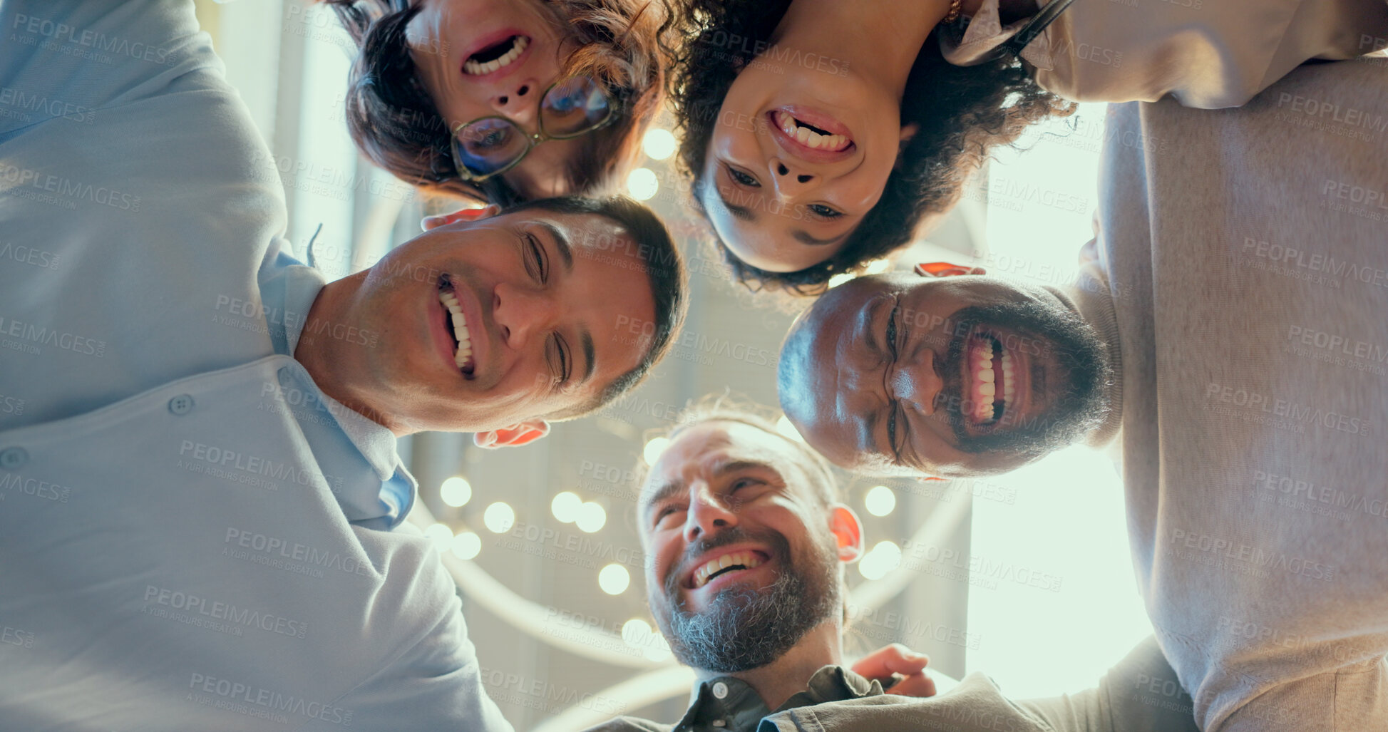 Buy stock photo Corporate group, low angle and huddle of happy business people in bokeh, workplace and team building spirit. POV, diverse stadd or employees and unity for motivation, collaboration and performance 