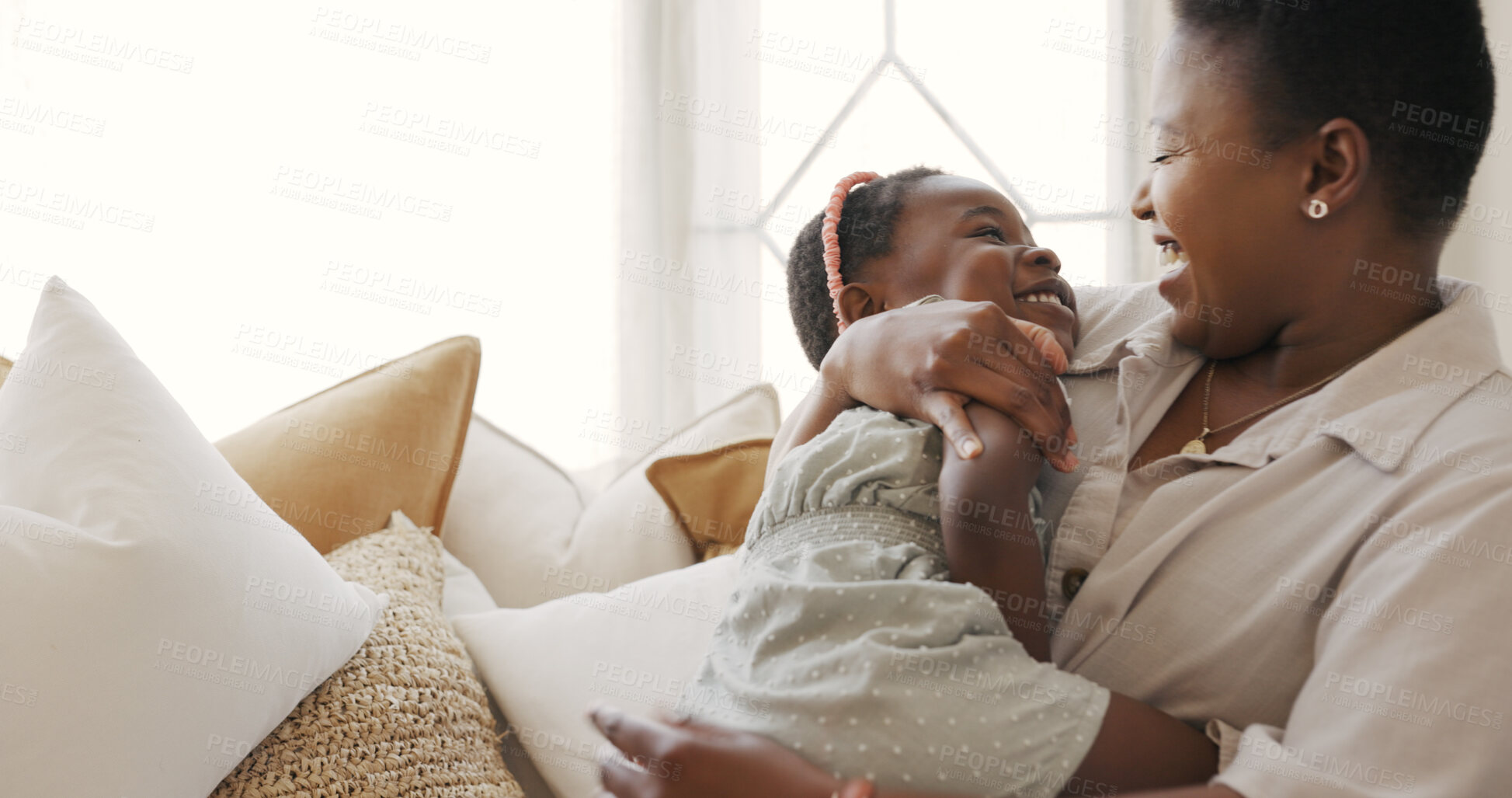 Buy stock photo Woman, kid and love for bond or sofa in happiness by smiling, laughing or bonding in living room. Black family, mother and kid for quality, time and together in embrace while joking, couch and home