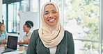 Face, muslim and mindset with a business woman in her office at work wearing a hijab for religion or faith. Portrait, vision and smile with an islamic female employee standing in her workplace