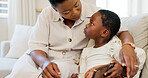 Social media, mother and child with a phone on the sofa for learning, education and communication in their house. Happy, smile and African baby and mom reading a chat on a mobile app on the couch