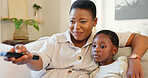 Love, mother and girl streaming a movie while relaxing on a sofa in the modern living room. Happy, smile and black family watching a film online in lounge while bonding, talking and resting together