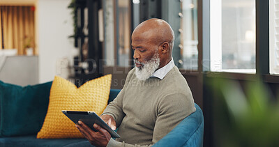 Tablet, technology and senior black man on sofa browse online website, social media and internet. Online shopping, retirement and elderly male enjoy freedom, weekend and relax with digital tech