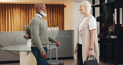 Travel and business people in partnership for business, b2b meeting and trust on a deal in a lobby. Welcome smile, agreement and employees with luggage on a trip for work
