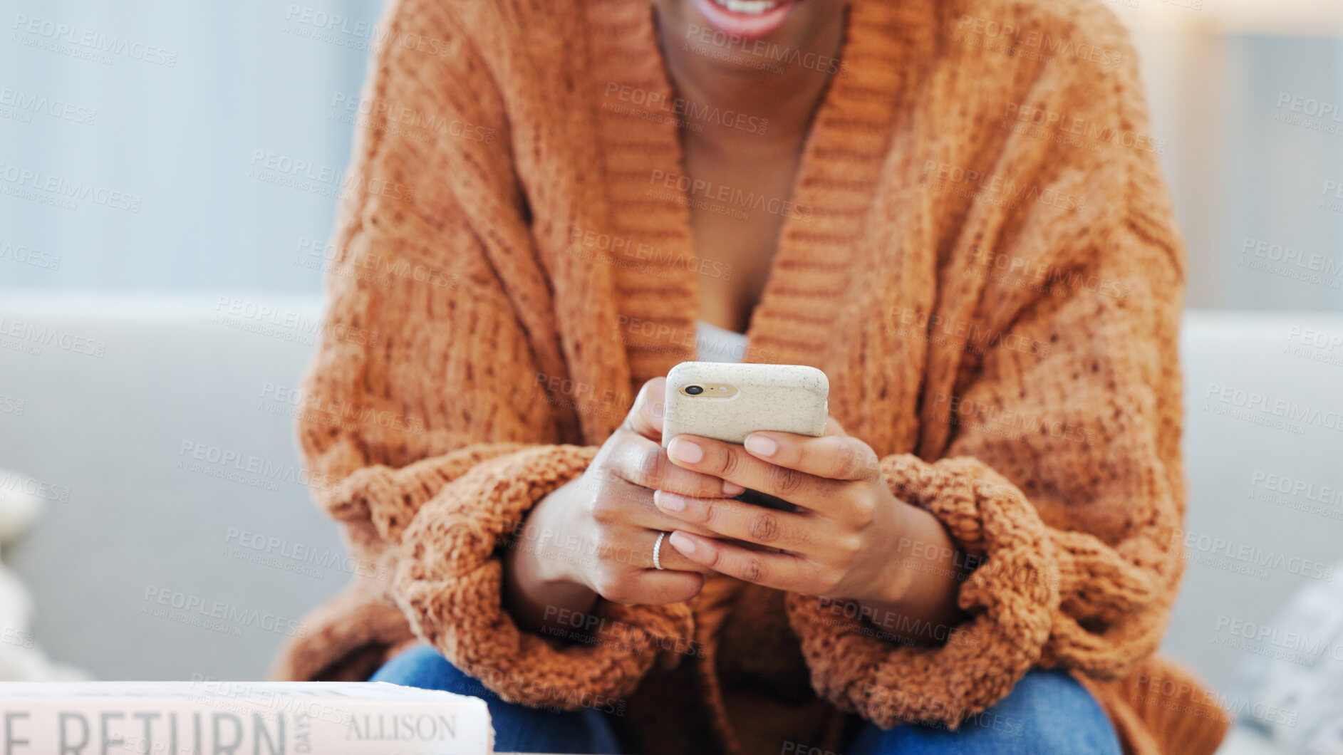 Buy stock photo Phone, hands and closeup of woman on sofa networking on social media, mobile app or the internet. Technology, online and African female person scroll on website with cellphone in living room at home.