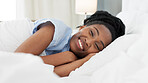 Sleep, bed and relax with a black woman sleeping in the bedroom of her home and dreaming. Resting, relaxing and peace with a young female lying on a pillow and under a duvet in a house in the morning