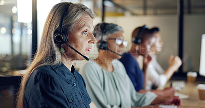 Call center, customer support and telemarketing with a senior woman at work as a consultant in her office. Crm, contact us and sales with a mature female consulting using a wireless headset at work